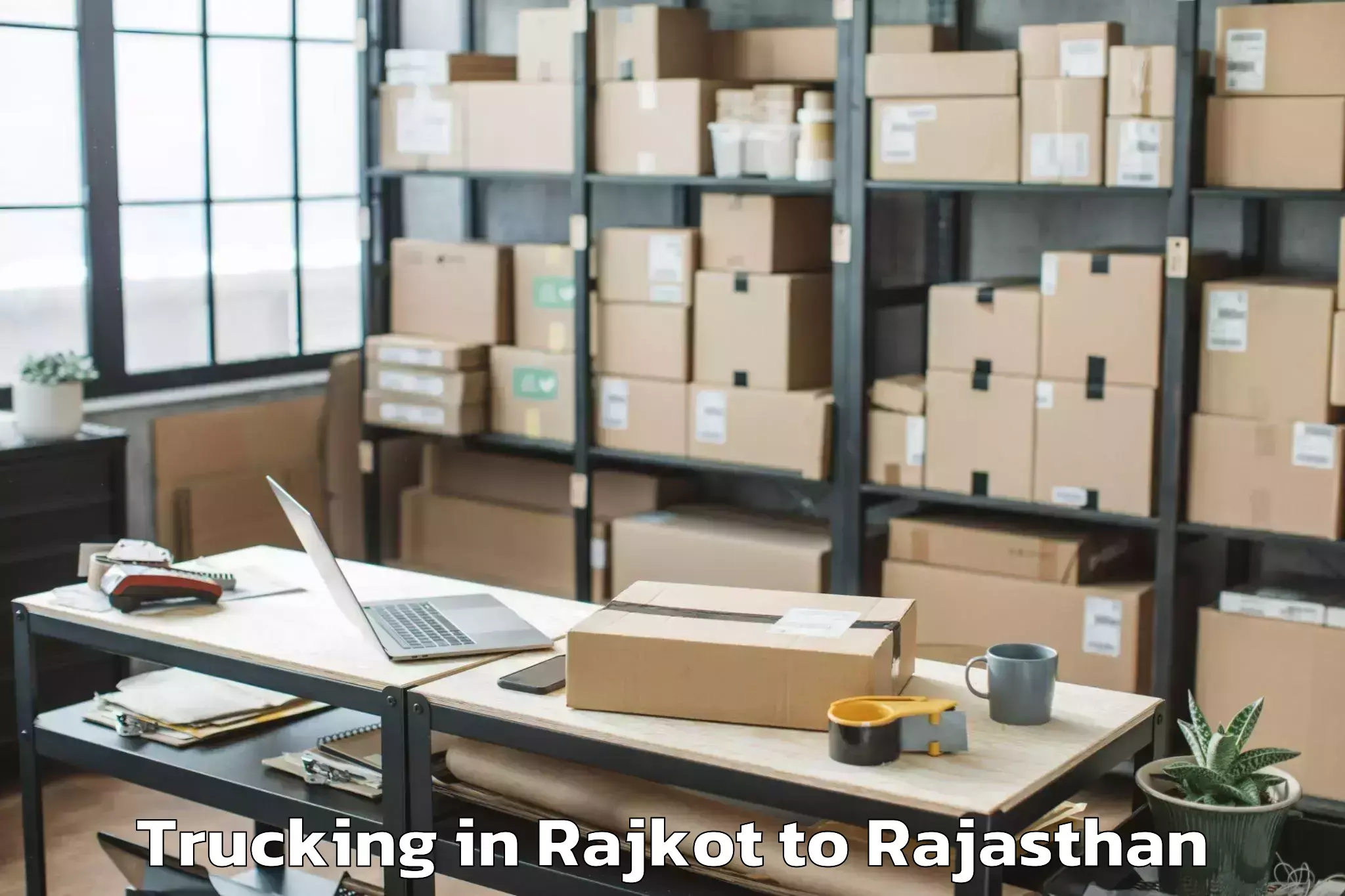 Easy Rajkot to Chauth Ka Barwara Trucking Booking